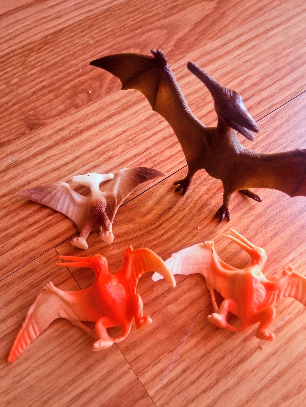 Set Of 4 Small Toy Dinosaurs.